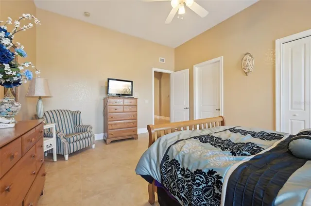 an aerial view of a house with swimming pool and glass doors