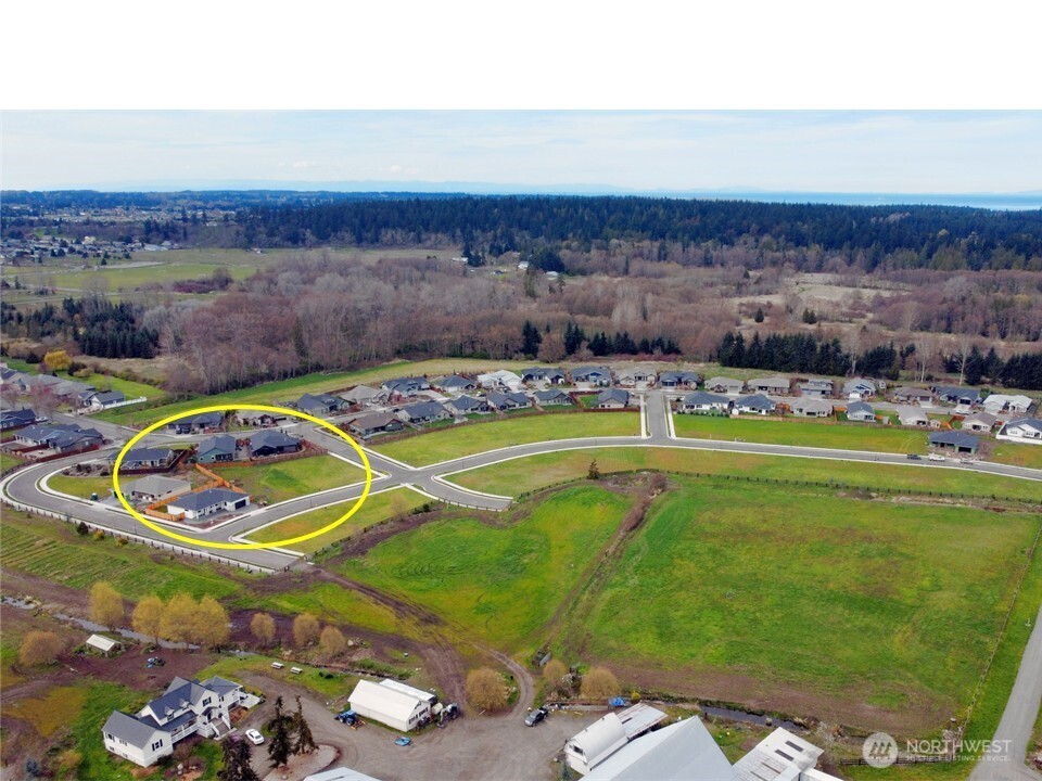a view of a swimming pool with a table and chairs