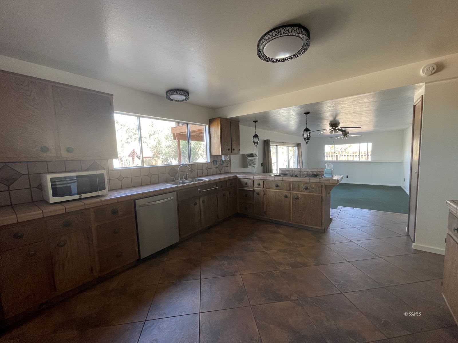 1562 West Reeves Avenue Ridgecrest, CA 93555 - Photo 5 of 45 a kitchen with stainless steel appliances granite countertop a sink and cabinets