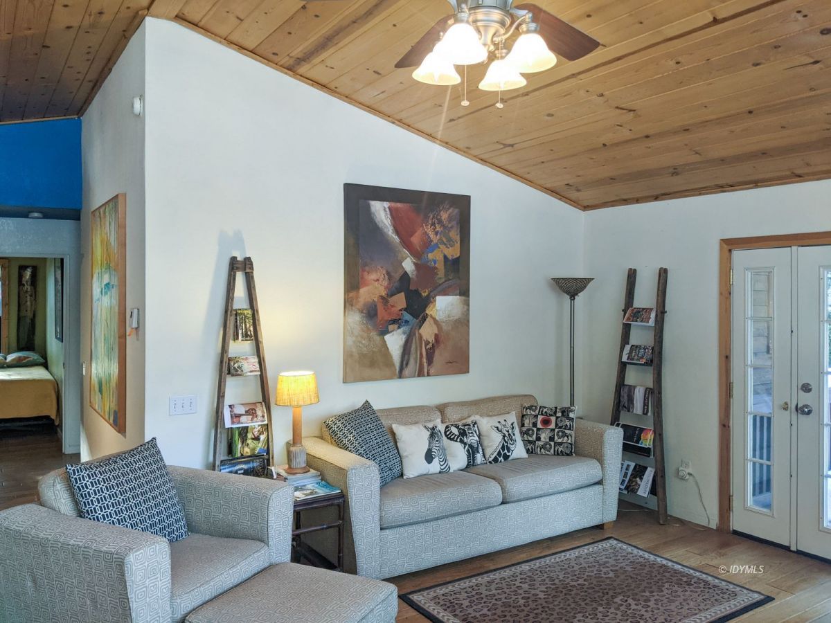 52790 Idyllmont Road Idyllwild, CA 92549 - Photo 14 of 65 a living room with furniture and a chandelier