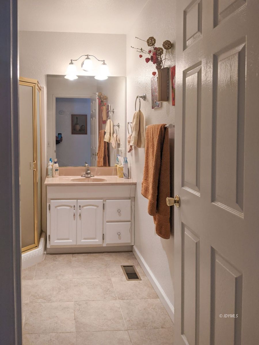 52790 Idyllmont Road Idyllwild, CA 92549 - Photo 26 of 65 a bathroom with a sink vanity and a mirror
