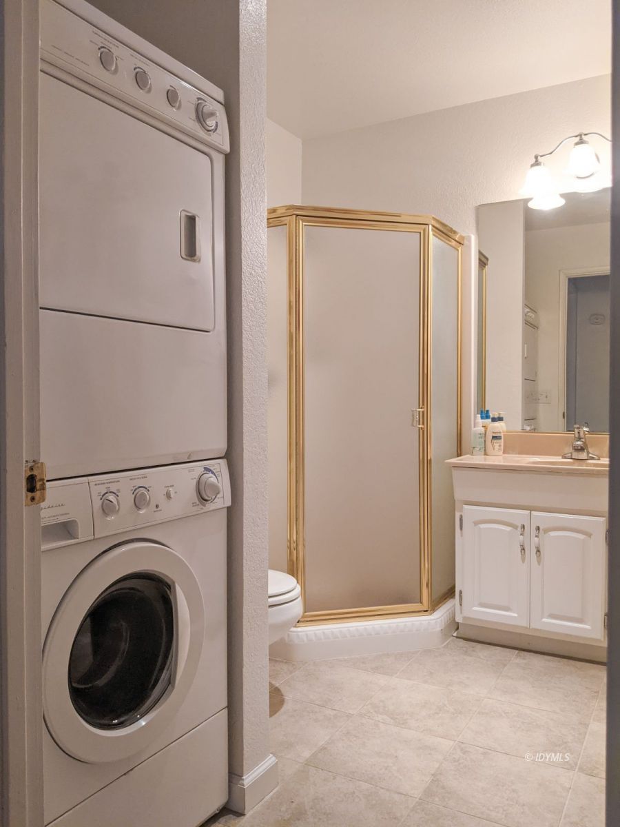 52790 Idyllmont Road Idyllwild, CA 92549 - Photo 27 of 65 a view of a hallway with washer and dryer