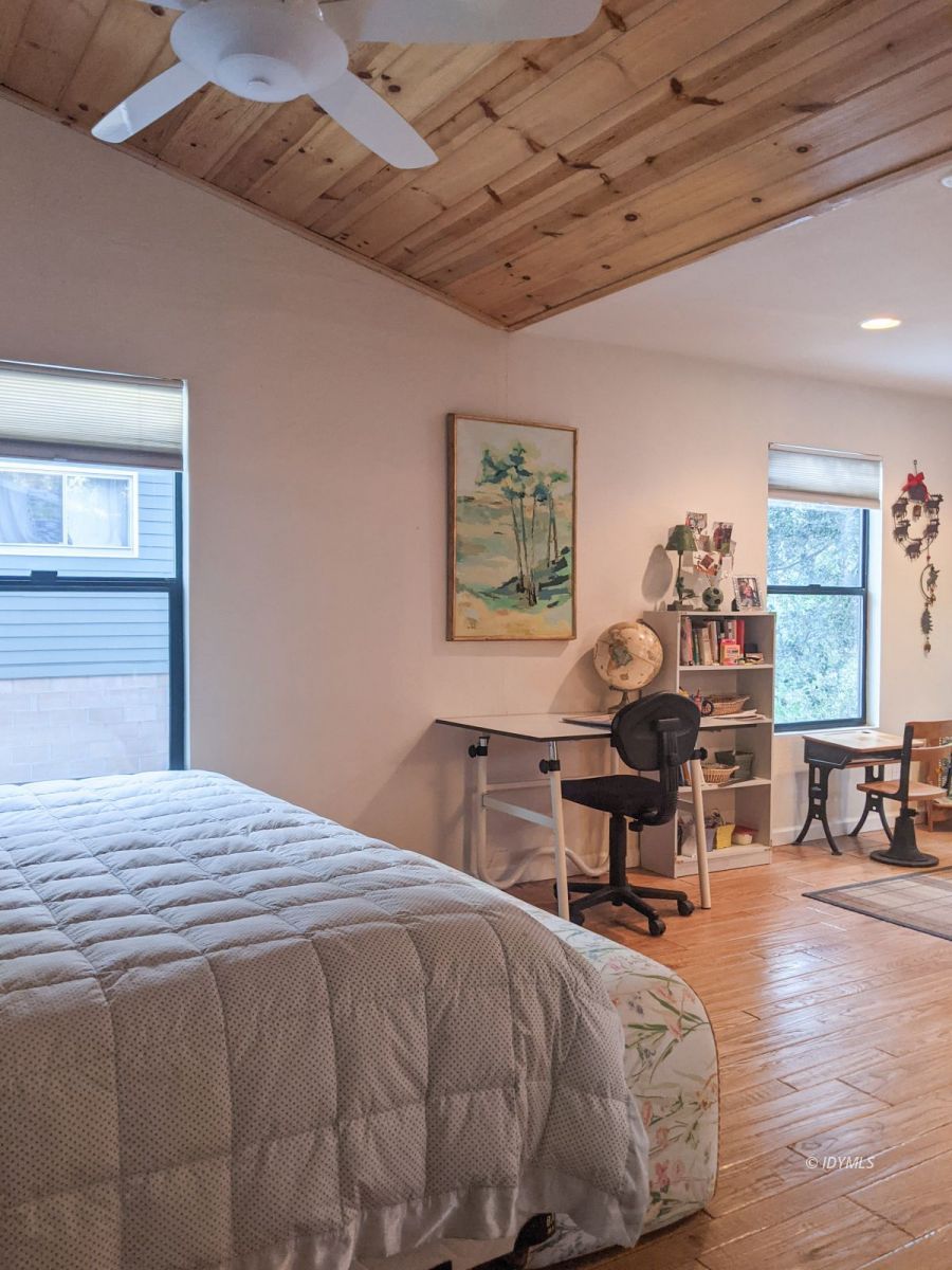 52790 Idyllmont Road Idyllwild, CA 92549 - Photo 29 of 65 a bedroom with a bed and a table