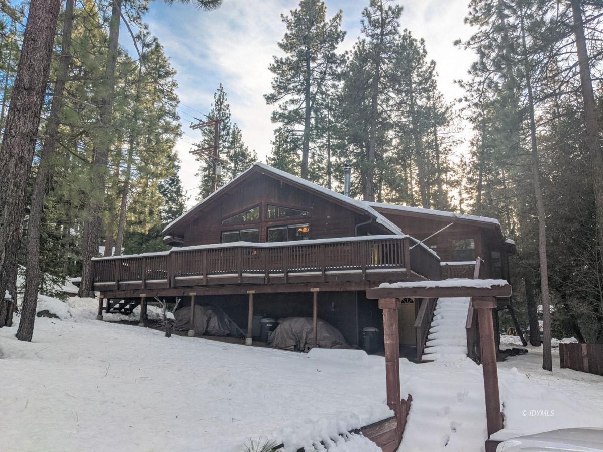 52790 Idyllmont Road Idyllwild, CA 92549 - Photo 3 of 65 a view of a house with a yard covered in snow