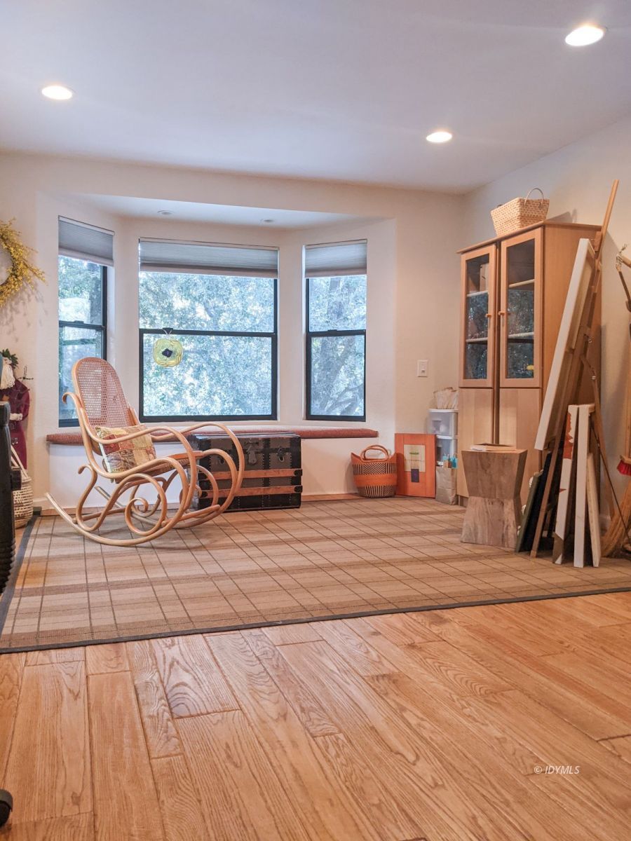 52790 Idyllmont Road Idyllwild, CA 92549 - Photo 39 of 65 a living room with large window and a wooden floor