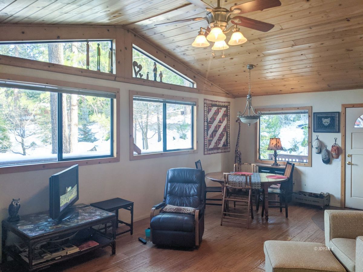 52790 Idyllmont Road Idyllwild, CA 92549 - Photo 4 of 65 a living room with furniture and a large window