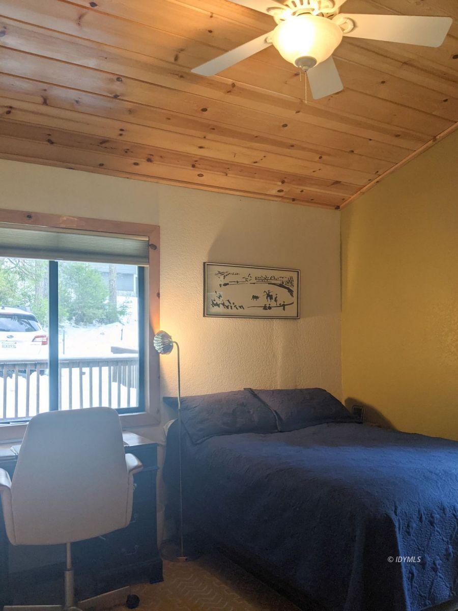 52790 Idyllmont Road Idyllwild, CA 92549 - Photo 47 of 65 a bed sitting in a bedroom next to a window