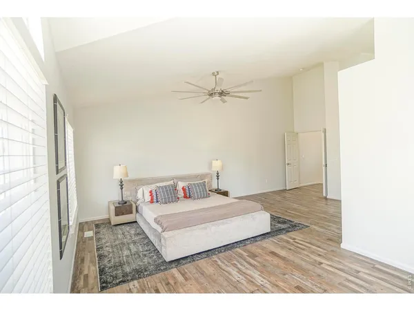 a living room with a bed furniture and a window
