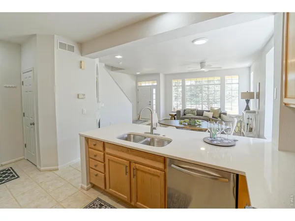 a kitchen with sink and cabinets