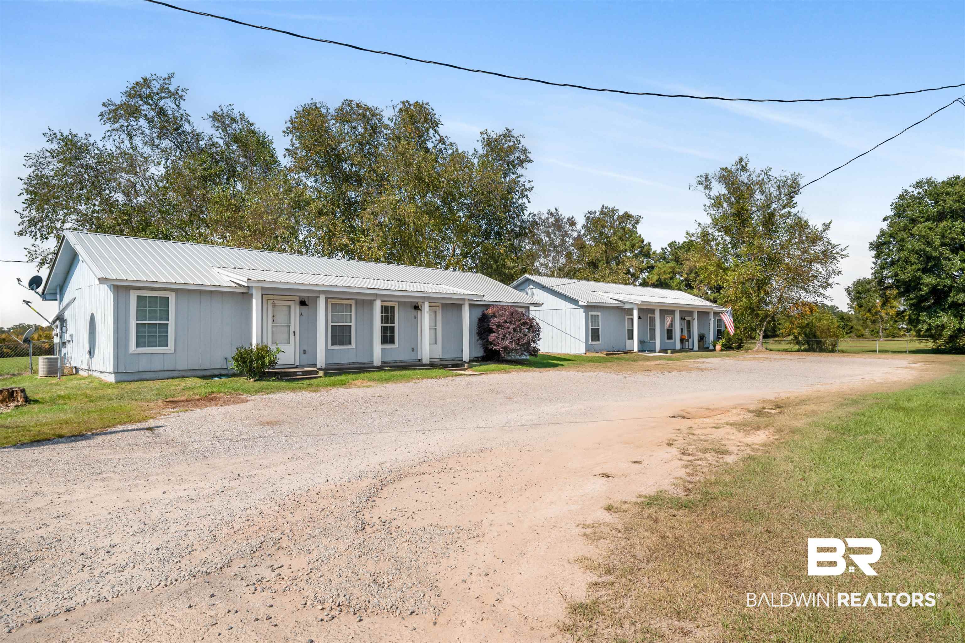 14919 Daugherty Road Foley, AL 36535 - Photo 27 of 27 Ranch-style house with central air condition unit and a front yard