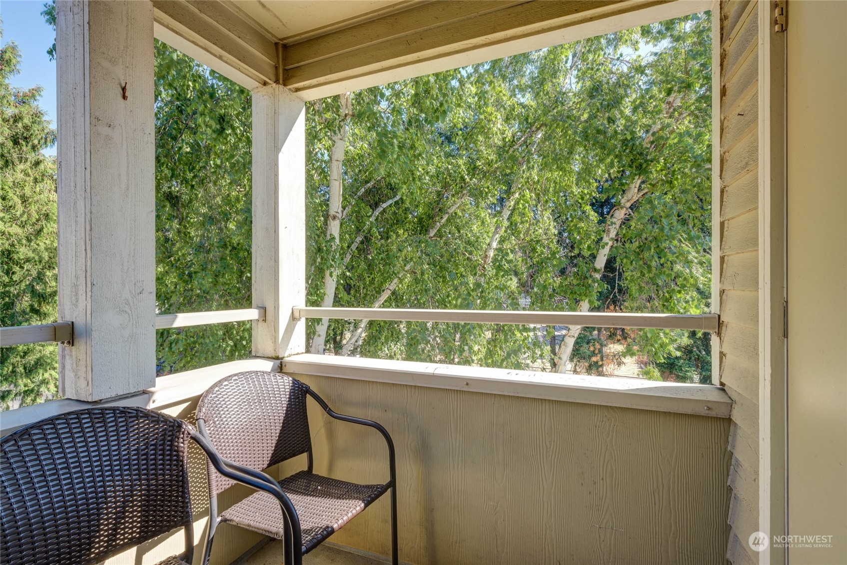 20318 Bothell Everett Highway, Unit A301 Bothell, WA 98012 - Photo 8 of 20 a view of a chair and table in the balcony