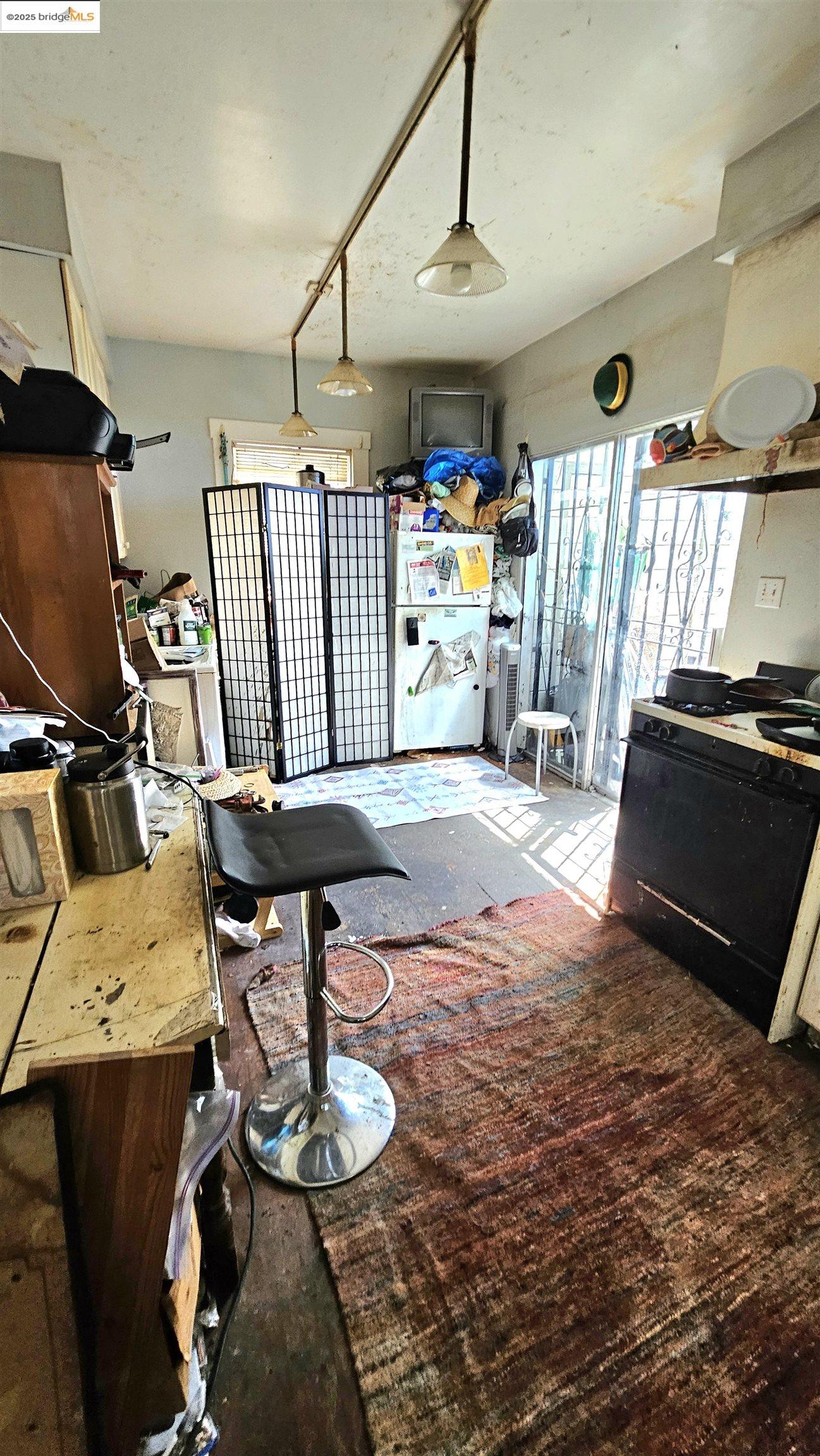 2308 Parker Street Berkeley, CA 94704 - Photo 11 of 17 a room with furniture and a chandelier