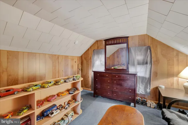 a bed room with a bed and a dresser