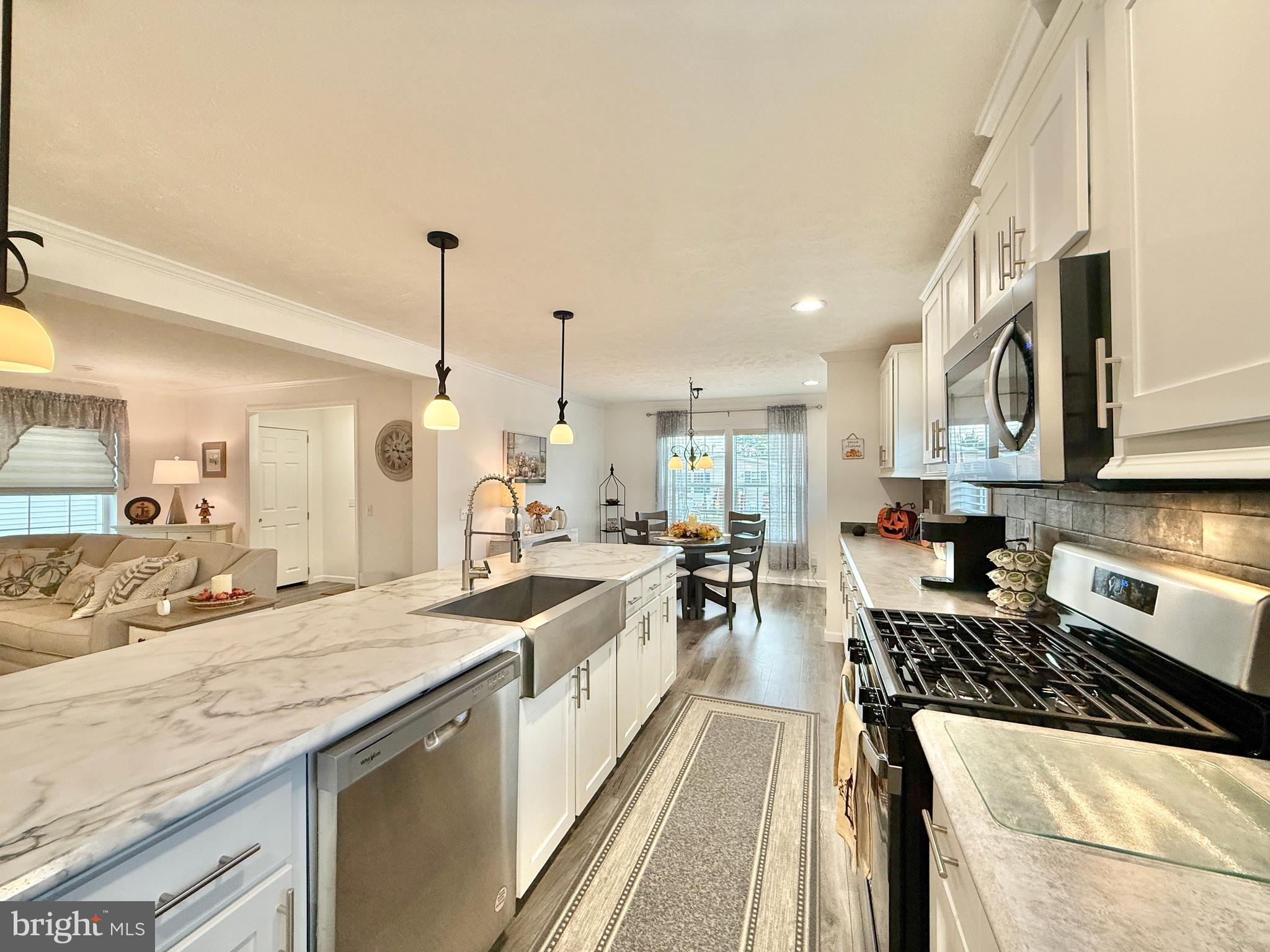 768 East Garden Road, Unit 7 Vineland, NJ 08360 - Photo 20 of 37 a large kitchen with granite countertop a large counter top appliances a sink and cabinets
