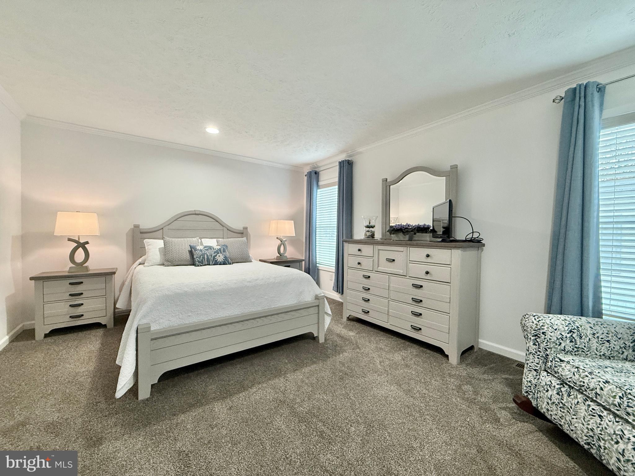 768 East Garden Road, Unit 7 Vineland, NJ 08360 - Photo 32 of 37 a bedroom with a bed and a dresser