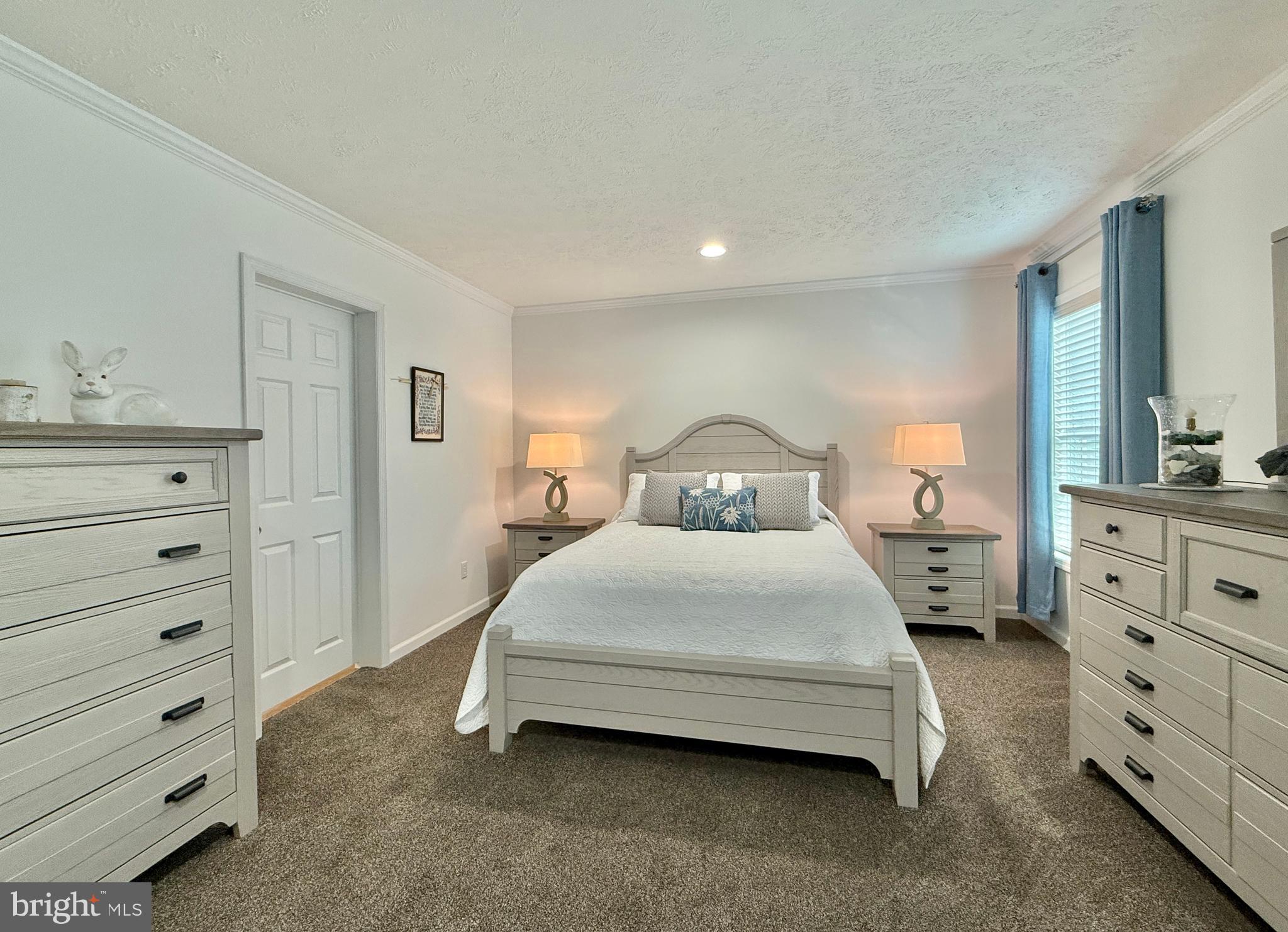 768 East Garden Road, Unit 7 Vineland, NJ 08360 - Photo 33 of 37 a bedroom with a bed and a dresser