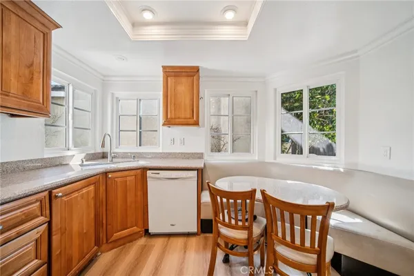 a bathroom with a tub a sink and a window