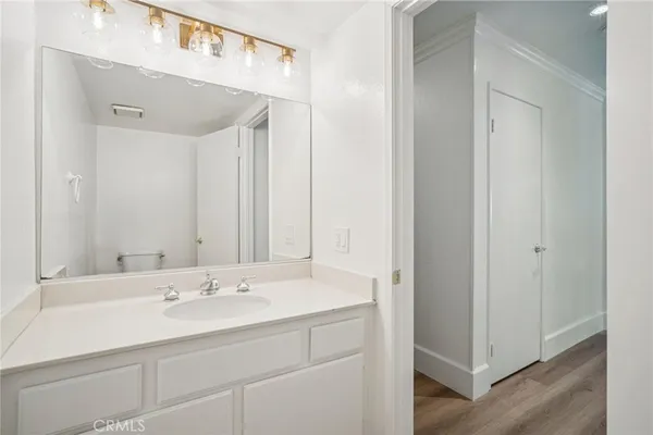 a view of hallway with wooden floor