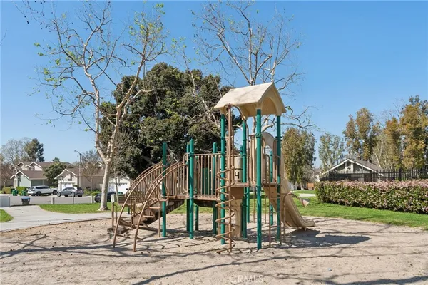a childrens park with lots of swings and slides