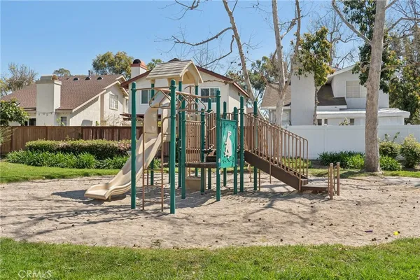 a view of a park with iron fence