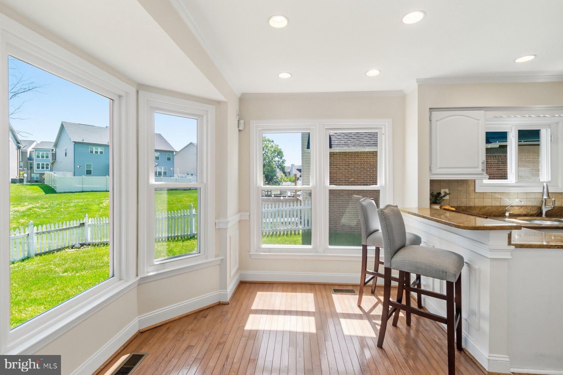 14215 Greenview Drive Laurel, MD 20708 - Photo 13 of 35 a view of a dining room with furniture window and wooden floor