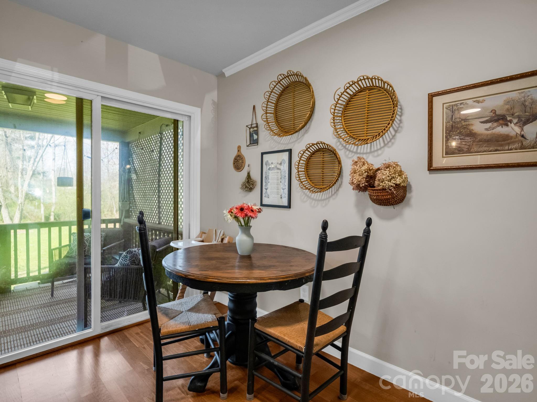 22 Macks Way Hendersonville, NC 28739 - Photo 11 of 42 a view of a dining room with furniture and wooden floor