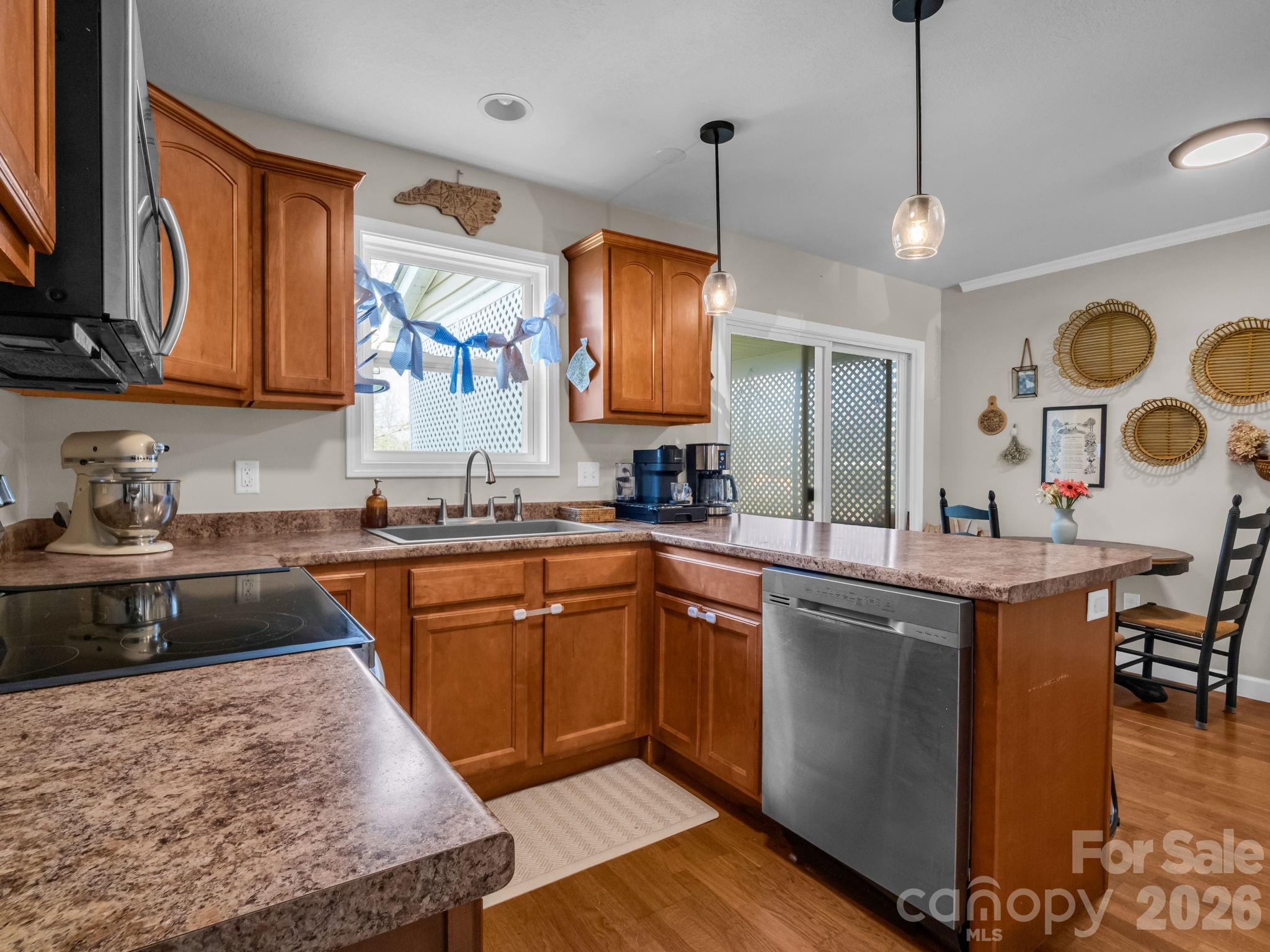 22 Macks Way Hendersonville, NC 28739 - Photo 13 of 42 a kitchen with stainless steel appliances granite countertop a sink a stove and a wooden floors