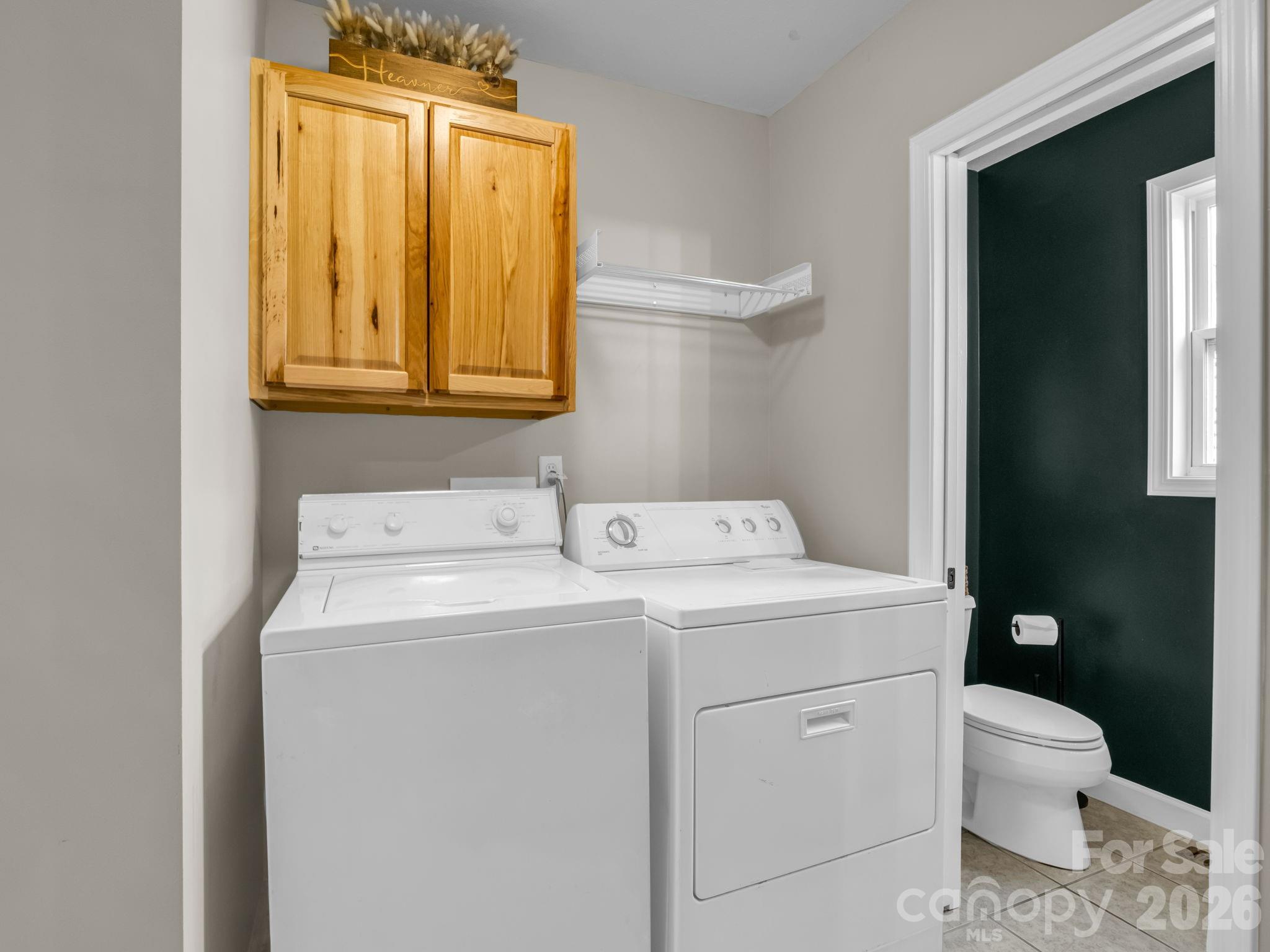22 Macks Way Hendersonville, NC 28739 - Photo 15 of 42 a bathroom with a sink toilet and mirror