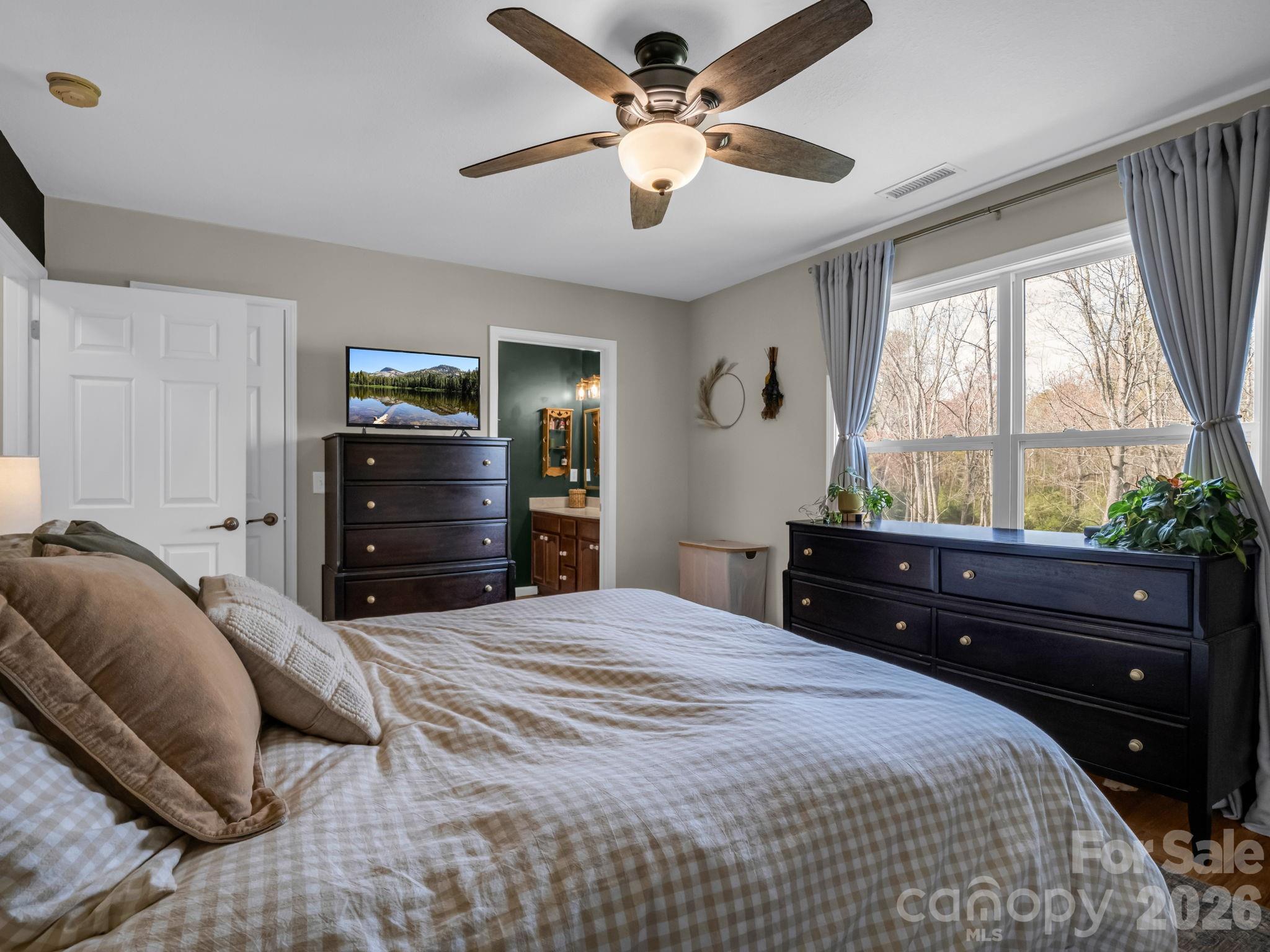 22 Macks Way Hendersonville, NC 28739 - Photo 22 of 42 a bedroom with a bed and window