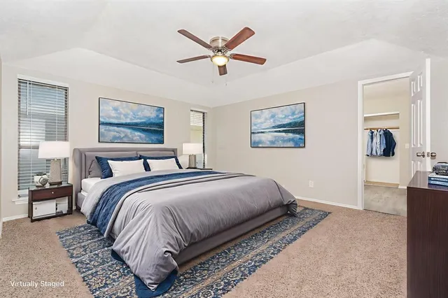 a bedroom with bed and window