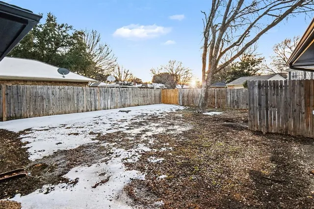 a view of a backyard of the house