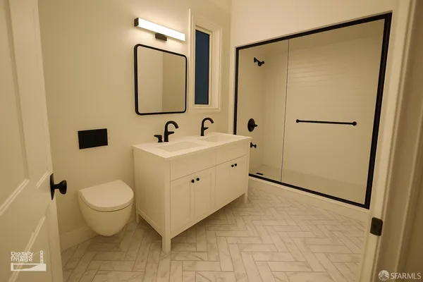 a bathroom with a toilet sink and mirror