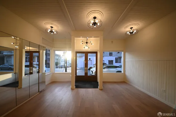 a view of a room with furniture and window