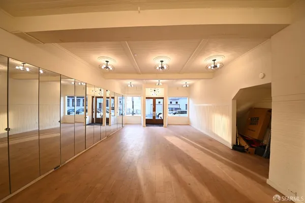 a view of a livingroom with furniture and a flat screen tv