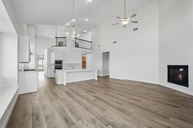 a view of kitchen with cabinets and wooden floor