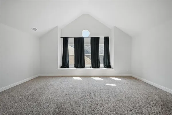 an empty room with windows and mountain view