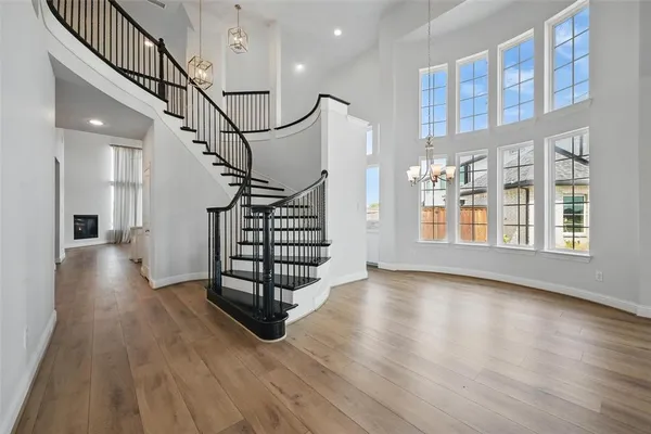 a view of entryway with stairs and wooden floor