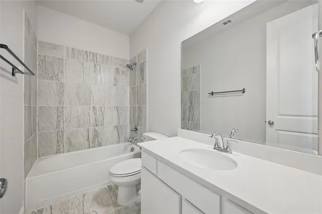 a picture of a bathroom with a shower
