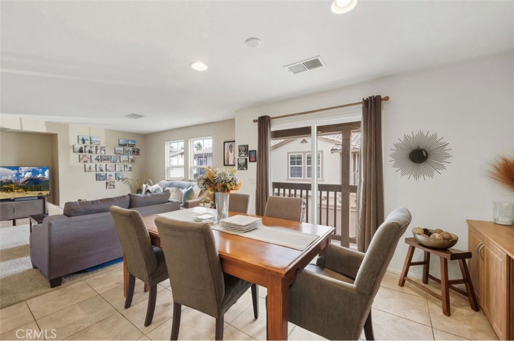 10326 Sparkling Drive, Unit 1 Rancho Cucamonga, CA 91730 - Photo 11 of 34 a view of a dining room with furniture