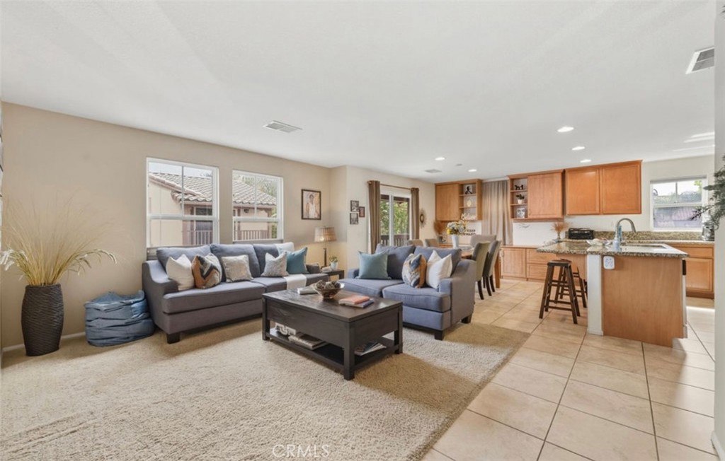10326 Sparkling Drive, Unit 1 Rancho Cucamonga, CA 91730 - Photo 13 of 34 a living room with furniture and a large window