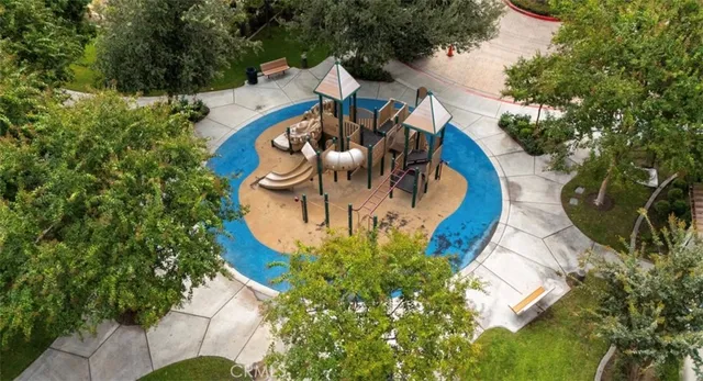 an aerial view of a house with outdoor space and swimming pool