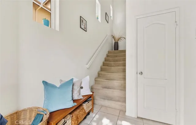 a view of a hallway with wooden floor and glass door
