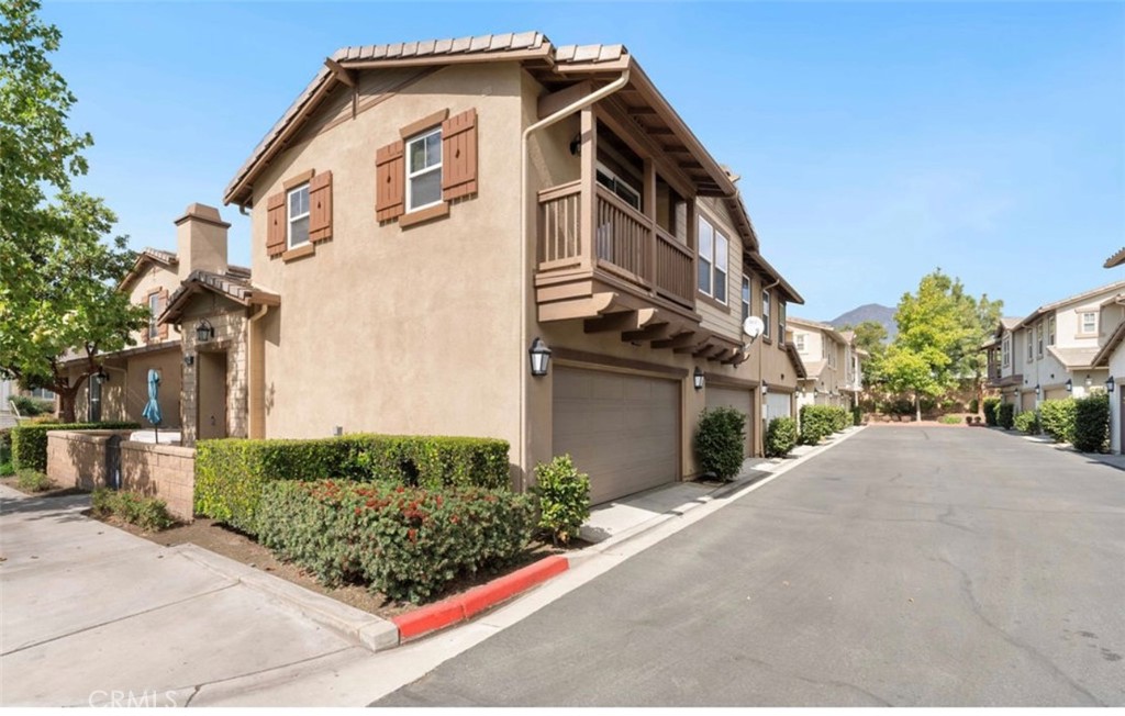 10326 Sparkling Drive, Unit 1 Rancho Cucamonga, CA 91730 - Photo 32 of 34 a view of a house with a yard