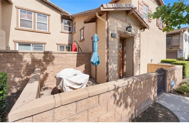 a view of a white house with large windows