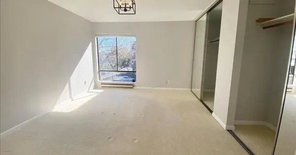 a view of empty room with a fireplace