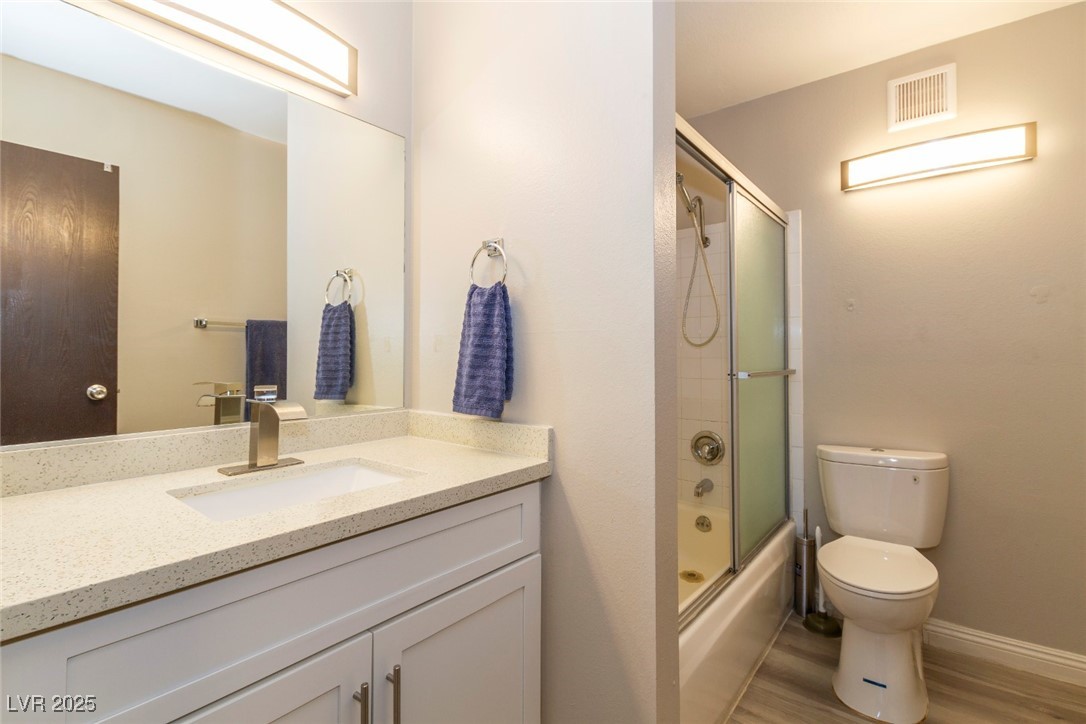 730 South Royal Crest Circle, Unit 421 Las Vegas, NV 89169 - Photo 13 of 21 Full bathroom featuring vanity, enclosed tub / sho