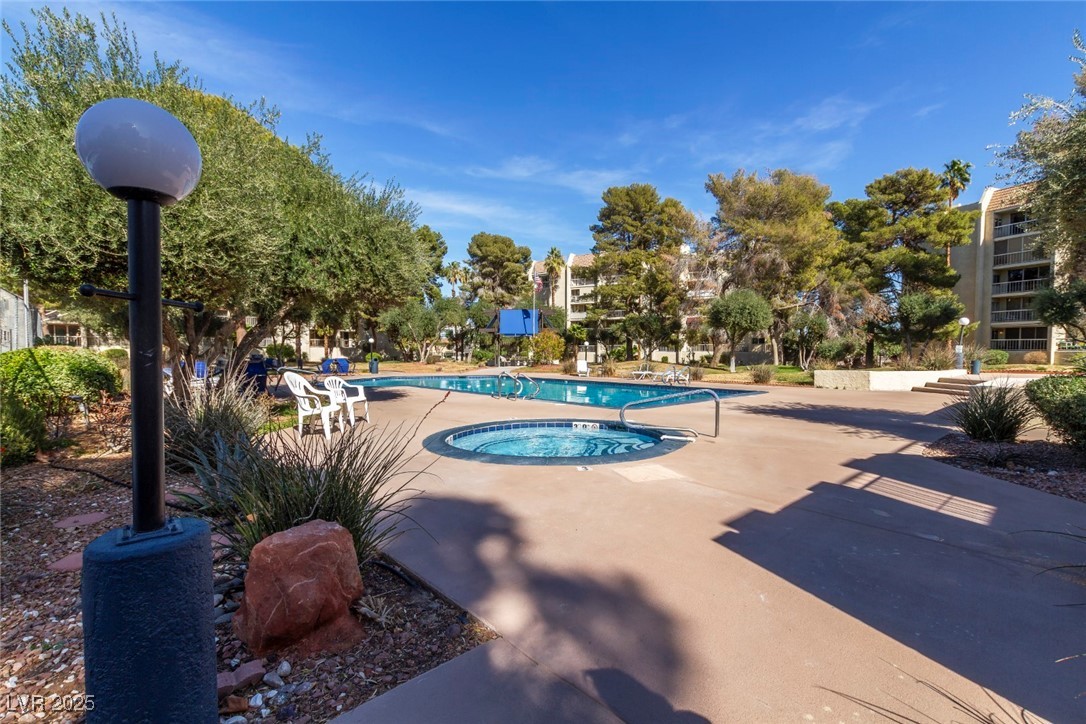 730 South Royal Crest Circle, Unit 421 Las Vegas, NV 89169 - Photo 17 of 21 Community pool with a hot tub and a patio