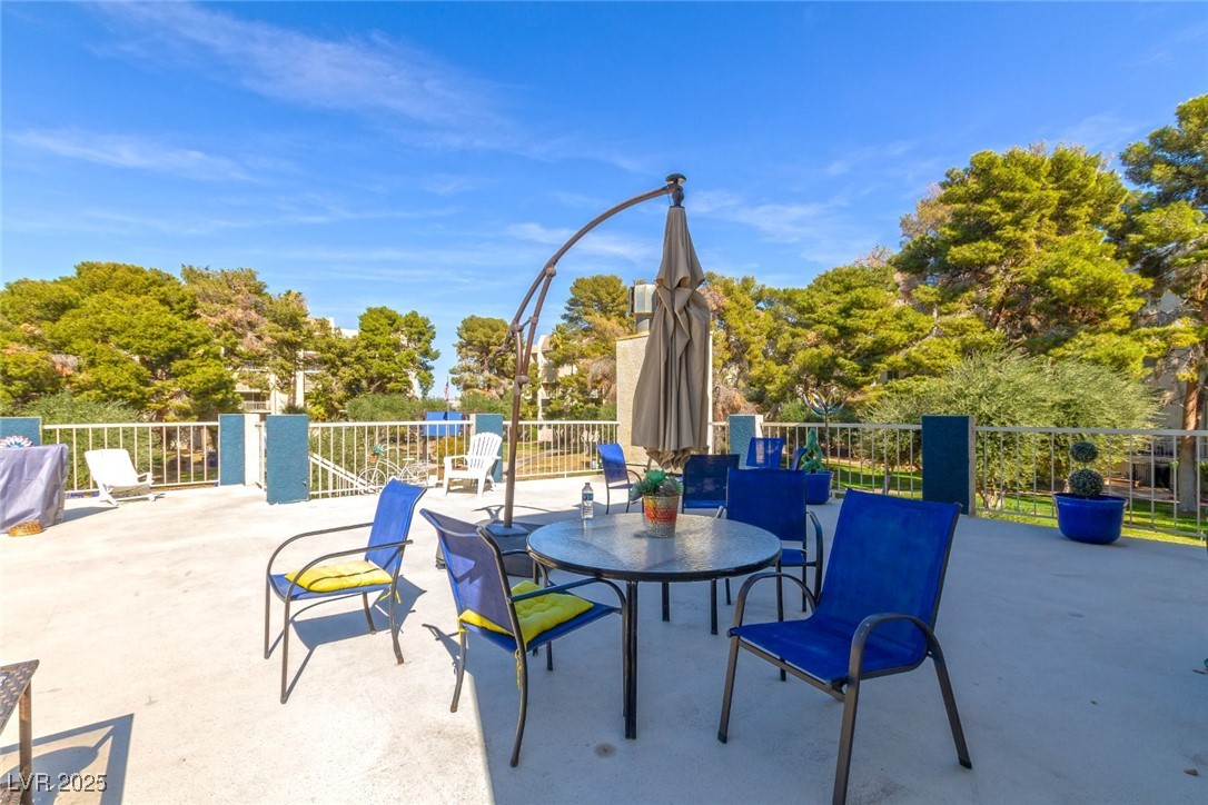 730 South Royal Crest Circle, Unit 421 Las Vegas, NV 89169 - Photo 18 of 21 View of patio / terrace featuring view of wooded a