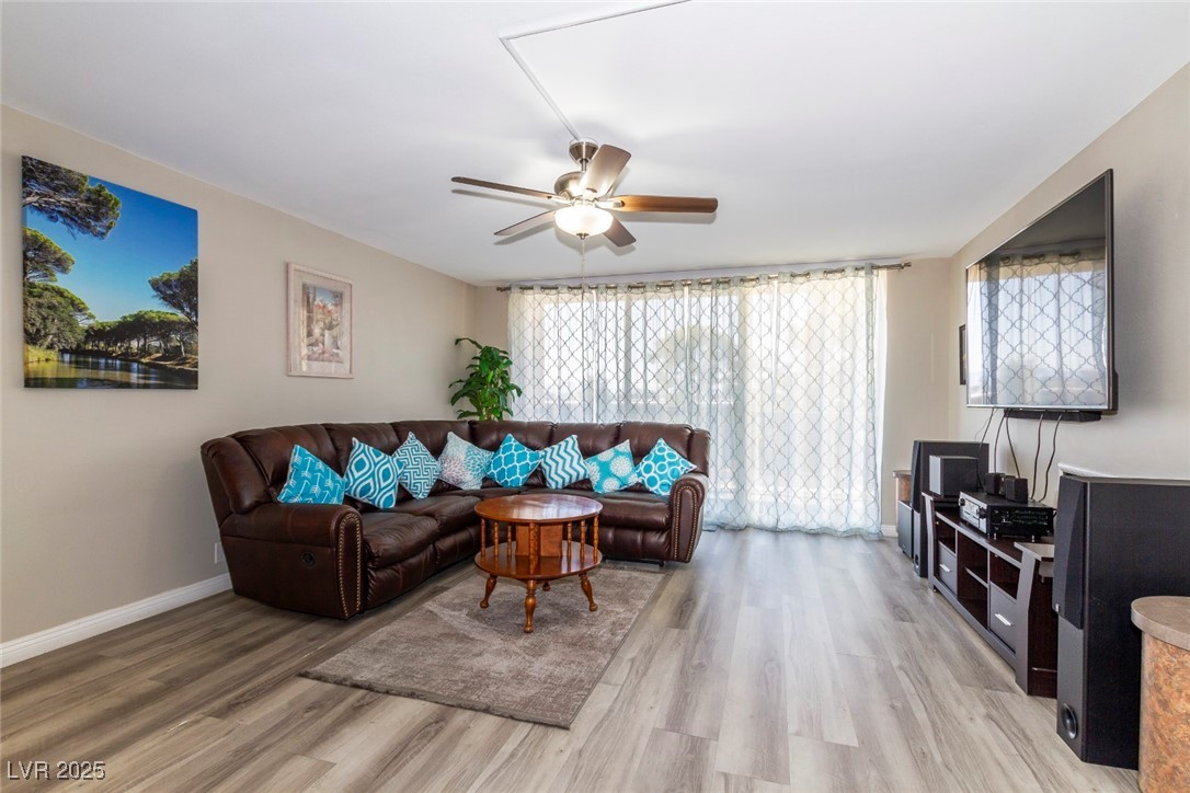 730 South Royal Crest Circle, Unit 421 Las Vegas, NV 89169 - Photo 2 of 21 Living room with light wood finished floors and a