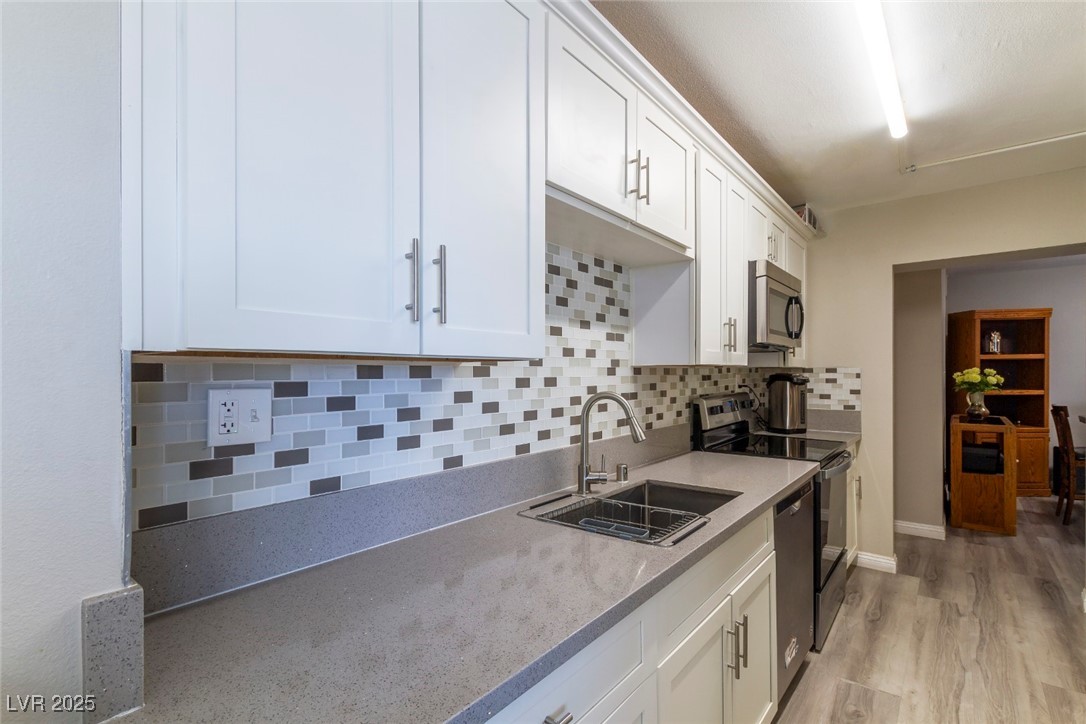 730 South Royal Crest Circle, Unit 421 Las Vegas, NV 89169 - Photo 8 of 21 Kitchen with tasteful backsplash, appliances with